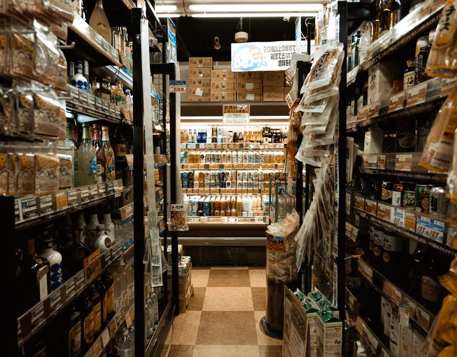 Well-stocked grocery store aisle with shelved products